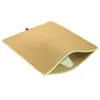 A beige cat litter mat with a honeycomb pattern is shown on a white background. A corner of the mat is lifted, revealing a pocket filled with white cat litter. Produktbild-Vorschau