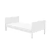 A white baby bed with a mattress on a white background. Produktbild-Vorschau