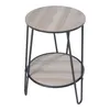 A round, two-tiered side table with a wood-look top and shelf, supported by black metal hairpin legs, presented against a white background. Anteprima dell’immagine prodotto