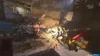 A scene of destruction with debris, fire, and a crane. Produktbild-Vorschau
