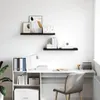 A clean, modern home office setup with a desk, chair, and shelves. Náhled obrázku produktu