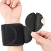 A person's wrist wearing a black wrist support with a close-up of the adjustable strap. Náhled obrázku produktu