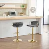 Two dark gray bar stools with gold legs and bases are shown in a kitchen setting. Produktbild-Vorschau