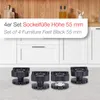 A set of four black furniture feet are displayed on a speckled gray surface in front of a white cabinet. Produktbild-Vorschau