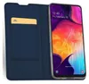 A blue flip case with a slot for a card, holding a smartphone with a colorful wallpaper. Náhľad obrázku produktu