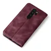 A burgundy flip cover phone case is shown from a diagonal top-down view against a white background. Produktbild-Vorschau