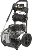 A black and gray gasoline-powered pressure washer with a hose reel and spray wand, shown against a white background. Náhled obrázku produktu