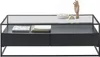 A modern black coffee table with a glass top, featuring two drawers and decorative items on top. Produktbild-Vorschau