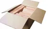 A cardboard box filled with pieces of wood. Voir les images du produit