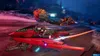 A character rides a futuristic red vehicle while another vehicle hovers behind it in a video game environment. Produktbild-Vorschau