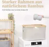 A laundry basket is shown next to a washing machine, with a shelf unit in the background. Náhľad obrázku produktu