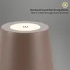 Close-up of the top of a brown table lamp with a touch-sensitive control surface illuminated. Anteprima dell’immagine prodotto