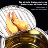 Fried shrimp on a draining rack over a pot of oil. Podgląd zdjęcia produktu