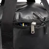Close-up of a black duffel bag with an open zipper pocket. Produktbild-Vorschau
