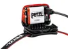Close-up of a Petzl headlamp battery compartment being charged. Produktbild-Vorschau