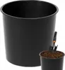 A black planter pot with a small shovel in a smaller pot filled with soil. Produktbild-Vorschau