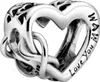 A close-up studio shot of a silver heart-shaped charm with intricate knotwork and engraved text. Anteprima dell’immagine prodotto