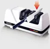 A white electric knife sharpener with a knife being sharpened. Produktbild-Vorschau