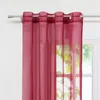 A close-up of a red sheer curtain hanging from a curtain rod. Produktbild-Vorschau