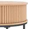 Close-up of a round coffee table with a fluted wood design and a black metal base. Produktbild-Vorschau