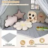 A children's play tent interior with plush toys and a mat. Voir les images du produit