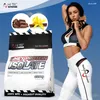 A woman in athletic wear poses next to a large bag of HI TEC Nutrition Whey Protein Isolate. Produktbild-Vorschau