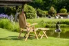 A wooden garden chair and footrest are set up on a grassy lawn next to a pond with a statue in it. The background features lush greenery and trees. Produktbild-Vorschau