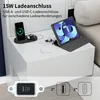 A bedside table with a tablet, smartphone, and smartwatch charging. Produktbild-Vorschau