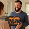 A man is smiling as he receives a gift box from another person. Náhled obrázku produktu