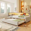 A bedroom scene featuring a beige upholstered daybed with a pull-out trundle bed, illuminated by LED lighting. Produktbild-Vorschau
