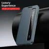 A teal smartphone case with a transparent window is displayed diagonally on a dark surface against a dark background. Náhled obrázku produktu