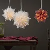 Three paper star lanterns are hanging above a wooden table with a dark red tablecloth and a small plant in a glass vase. Podgląd zdjęcia produktu