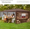 A group of people are sitting around a table under a brown gazebo, enjoying a meal outdoors. Náhled obrázku produktu