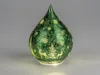 A green, tear-drop shaped decorative glass object with a frosted, illuminated effect, featuring a Christmas-themed design of reindeer and trees. Produktbild-Vorschau