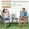 A couple relaxing on a patio with a table and chairs. Náhľad obrázku produktu