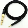 A black audio cable with gold and black connectors on a white background. Produktbild-Vorschau