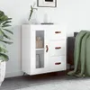 A white sideboard with a glass door and drawers, decorated with a plant and vases, in a room setting. Náhľad obrázku produktu