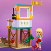 A LEGO Friends lifeguard tower and a mini-doll figure on a purple background. Podgląd zdjęcia produktu