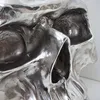 A close-up view of a metallic skull sculpture. Podgląd zdjęcia produktu