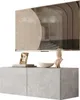 A modern TV cabinet with a TV mounted above it, decorated with a picture frame, a bowl, and a bust. Náhled obrázku produktu