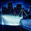 A futuristic cityscape at night with a car driving on a road. Náhled obrázku produktu