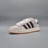 A single Adidas Campus 00S sneaker is shown against a plain grey background. Voir les images du produit
