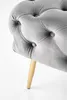 Close-up of a tufted upholstered bench leg. Produktbild-Vorschau
