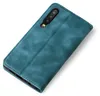 A teal-colored flip case for a smartphone is shown against a white background. Produktbild-Vorschau