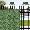 A split image showing a garden fence with artificial ivy on one side and a black metal fence with a swimming pool and lawn on the other side. Voir les images du produit