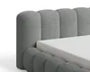 A close-up view of a bed frame with a mattress. Voir les images du produit