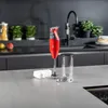 A red Bamix immersion blender and its accessories are displayed on a kitchen counter. Anteprima dell’immagine prodotto
