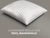 A white quilted pillow is shown on a gray background with text overlay. Produktbild-Vorschau