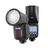 A black Godox V1S camera flash with a round head is shown against a white background. The flash is emitting light. Produktbild-Vorschau