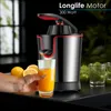 A hand is holding a glass of orange juice next to a juicer, with lemons and other glasses in the background. Produktbild-Vorschau